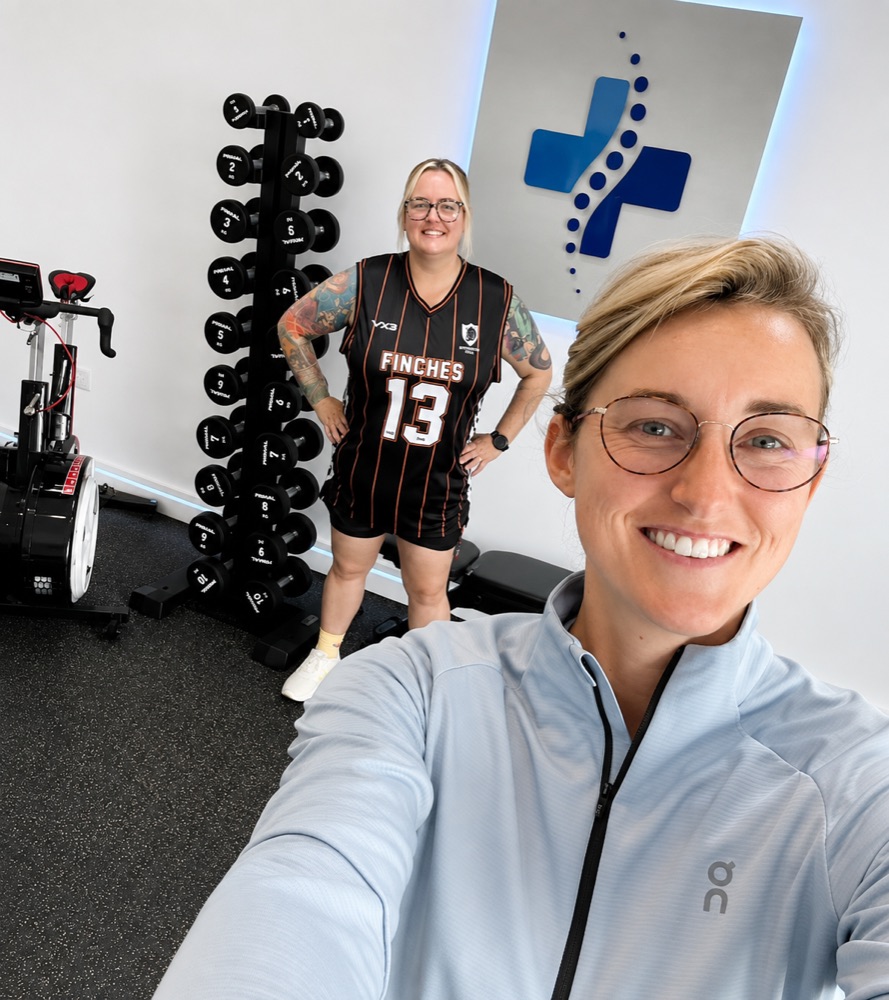 Tilly and a client in the clinic gym